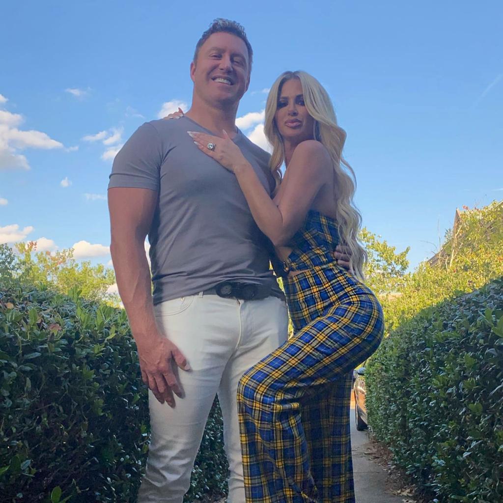 kroy biermann and kim zolciak in a field