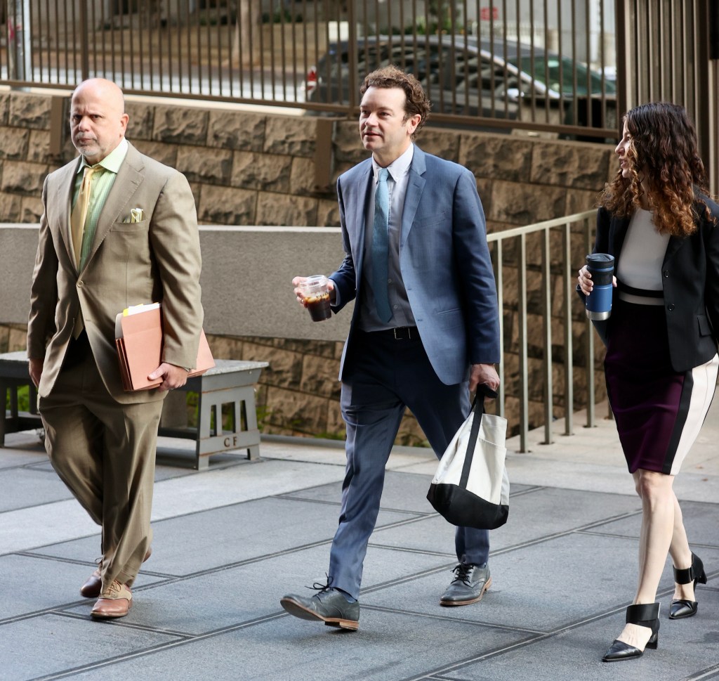 Danny Masterson walking to court with his lawyers.