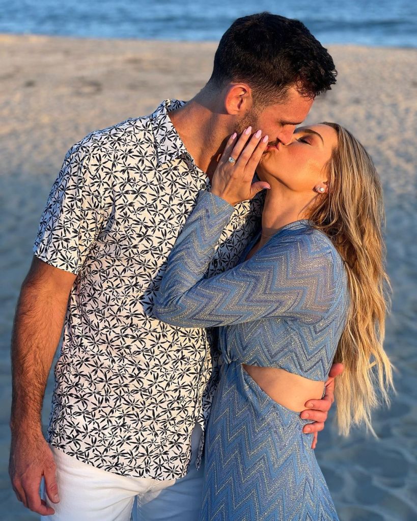 Lindsey Hubbard and Carl Radke kissing on the beach.