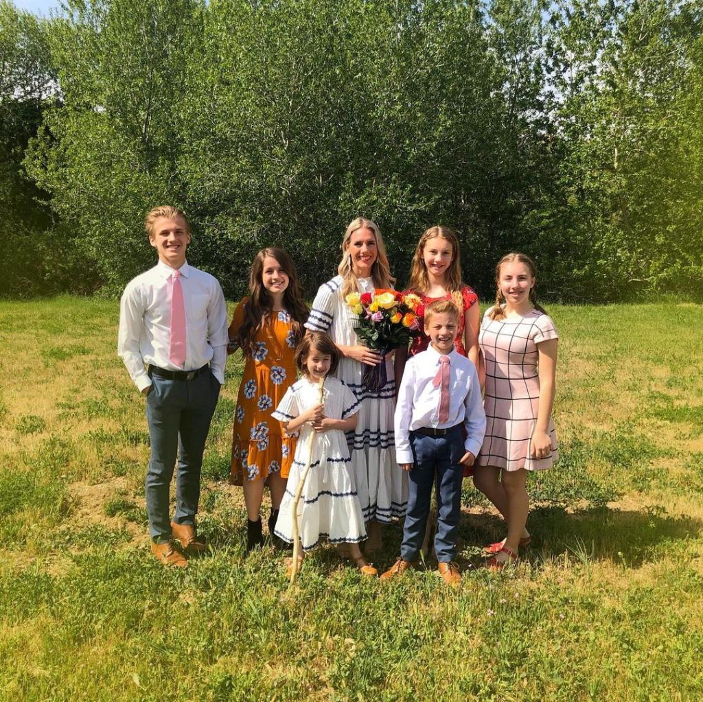 ruby franke standing in a field with her six kids