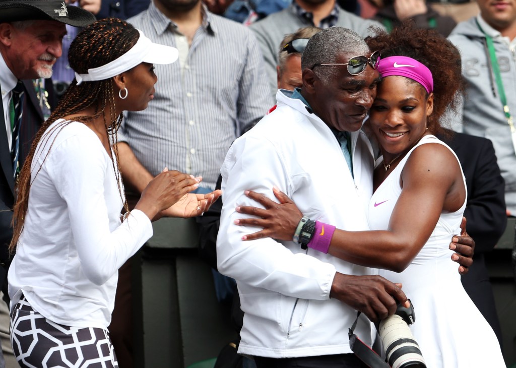 serena williams hugging her father with venus by her side