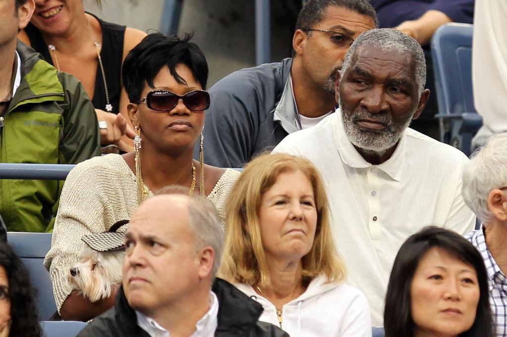 richard and lakeisha williams watching a tennis match