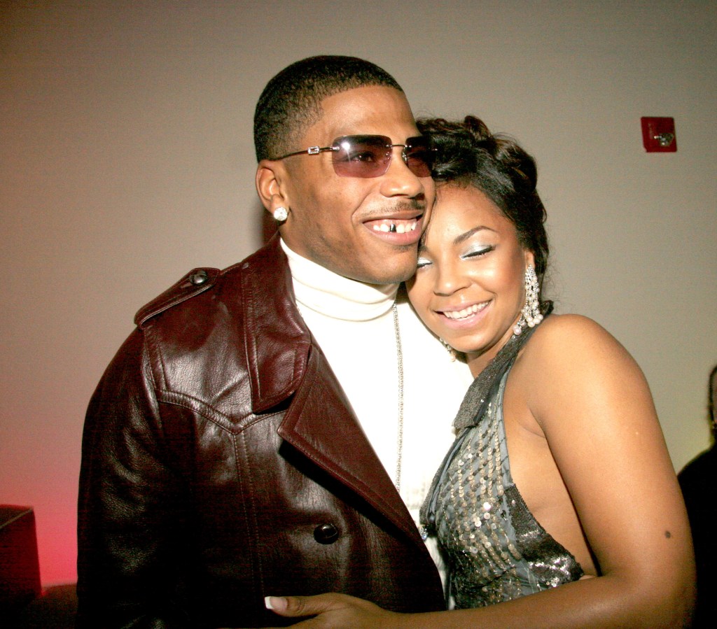 ashanti leaning her head on nelly's chest