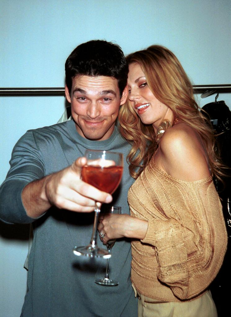 Eddie Cibrian, holding a drink in wine glass, and Brandi Glanville. 