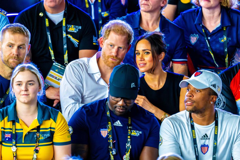 Meghan Markle and Prince Harry showing PDA at the 2023 Invictus Games. 