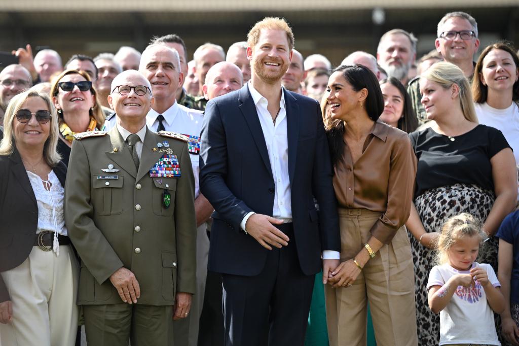 Meghan Markle and Prince Harry showing PDA at the 2023 Invictus Games. 