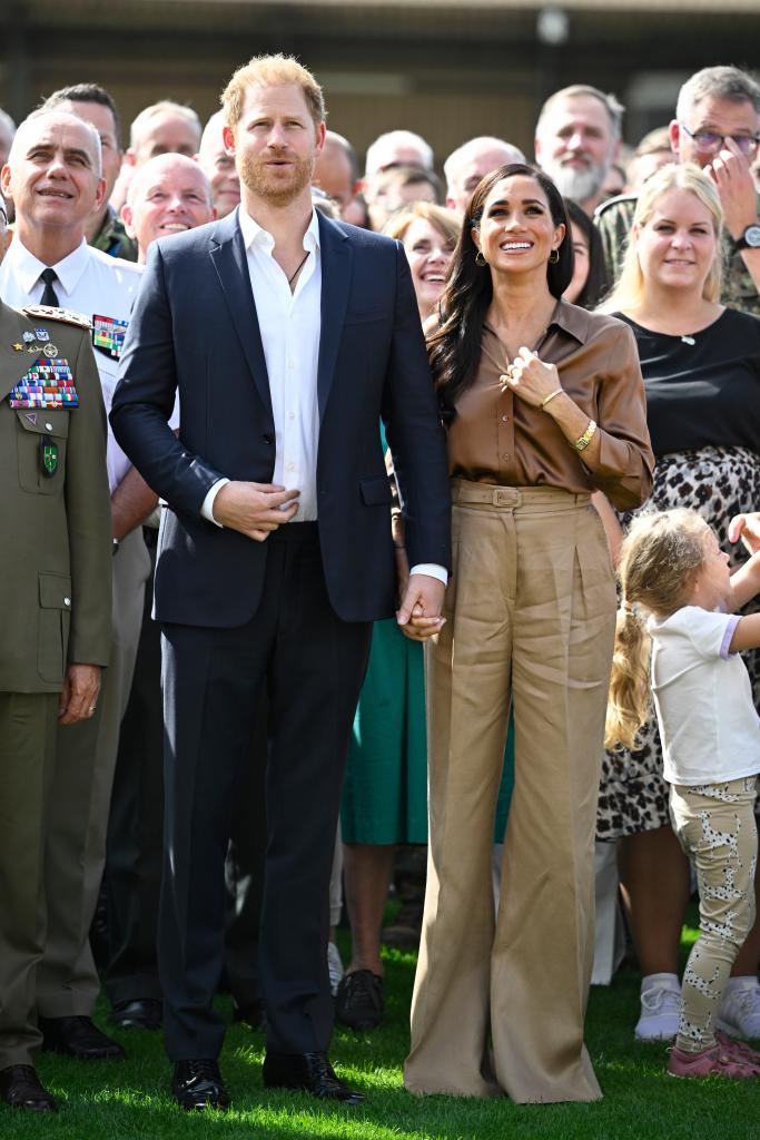 Meghan Markle and Prince Harry showing PDA at the 2023 Invictus Games.