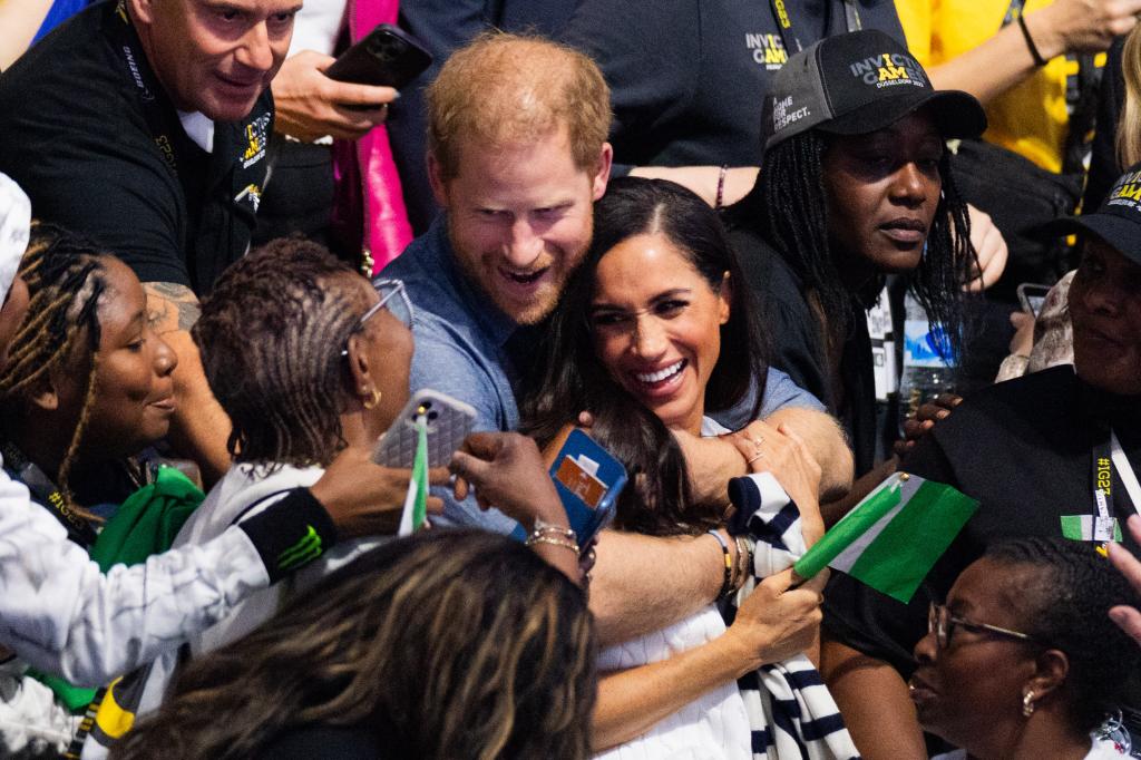 Meghan Markle and Prince Harry showing PDA at the Invictus Games.