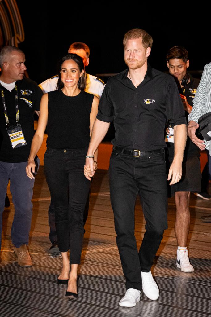 Meghan Markle and Prince Harry showing PDA at the 2023 Invictus Games. 