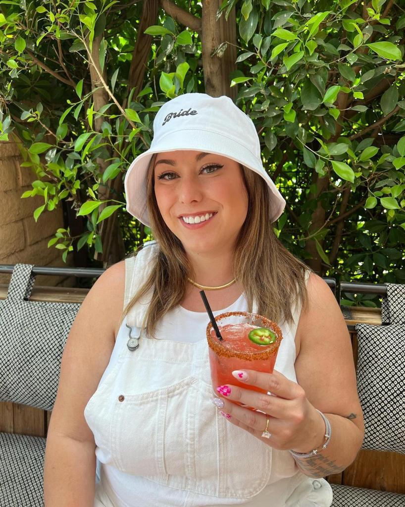 Alaina Scott holding a margarita.