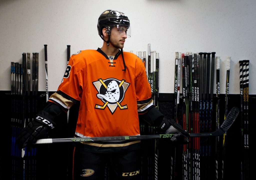 Nic Kerdiles standing in his hockey uniform.