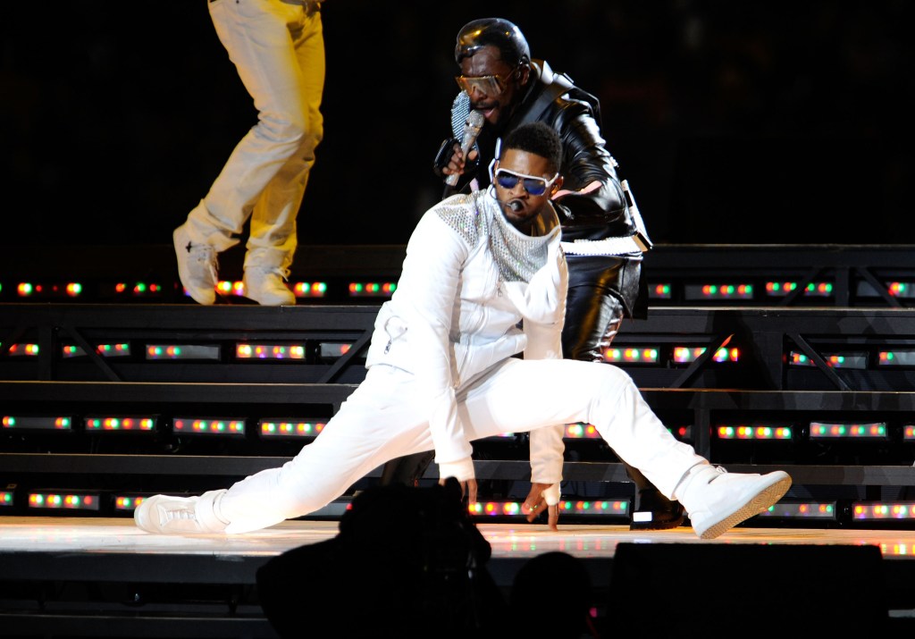 Usher performing with Black Eyed Peas during Super Bowl 2011