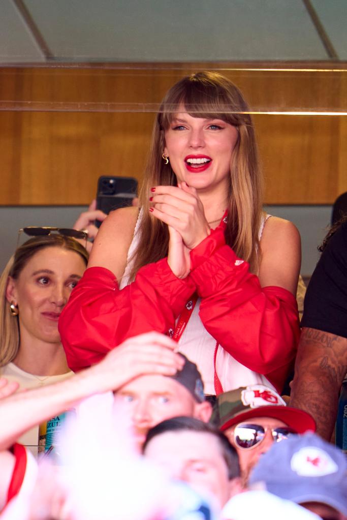 Taylor Swift cheering at an NFL game.