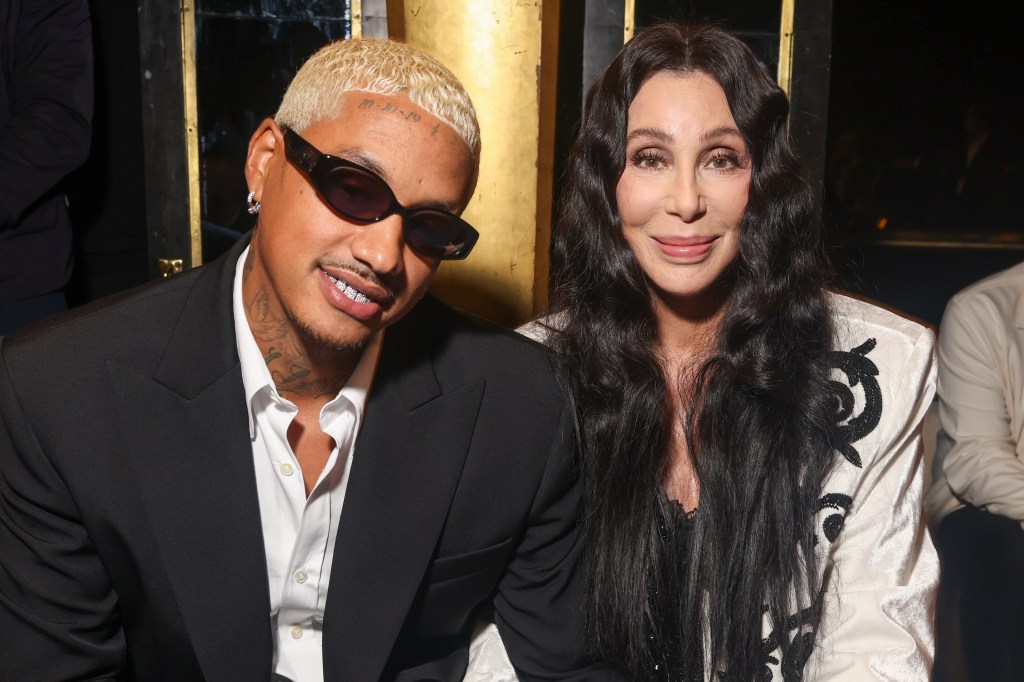 Cher and Alexander Edwards in black at Paris Fashion Week.