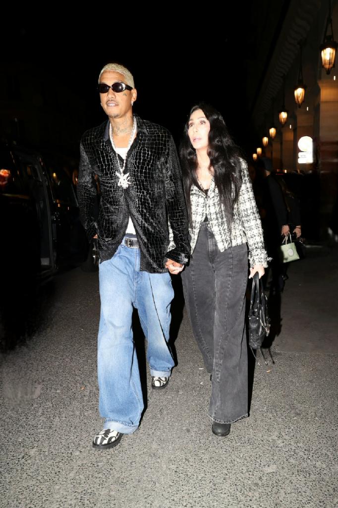 Alexander Edwards and Cher sitting front row during Paris Fashion week.