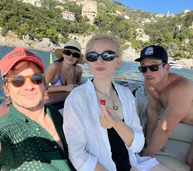 julia garner on a boat with friends