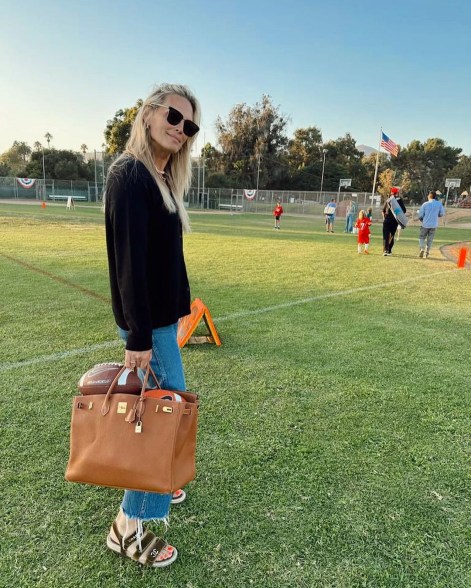 molly sims standing on a soccer pitch