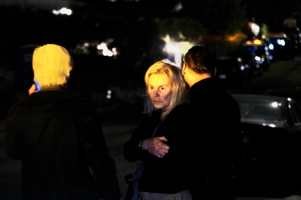 Suzanne looks grief-stricken after arriving at her son's home.