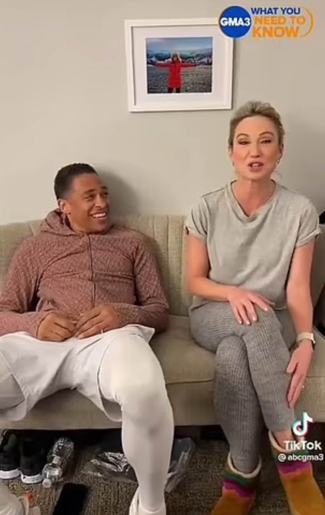 tj holmes and amy robach sitting on a couch