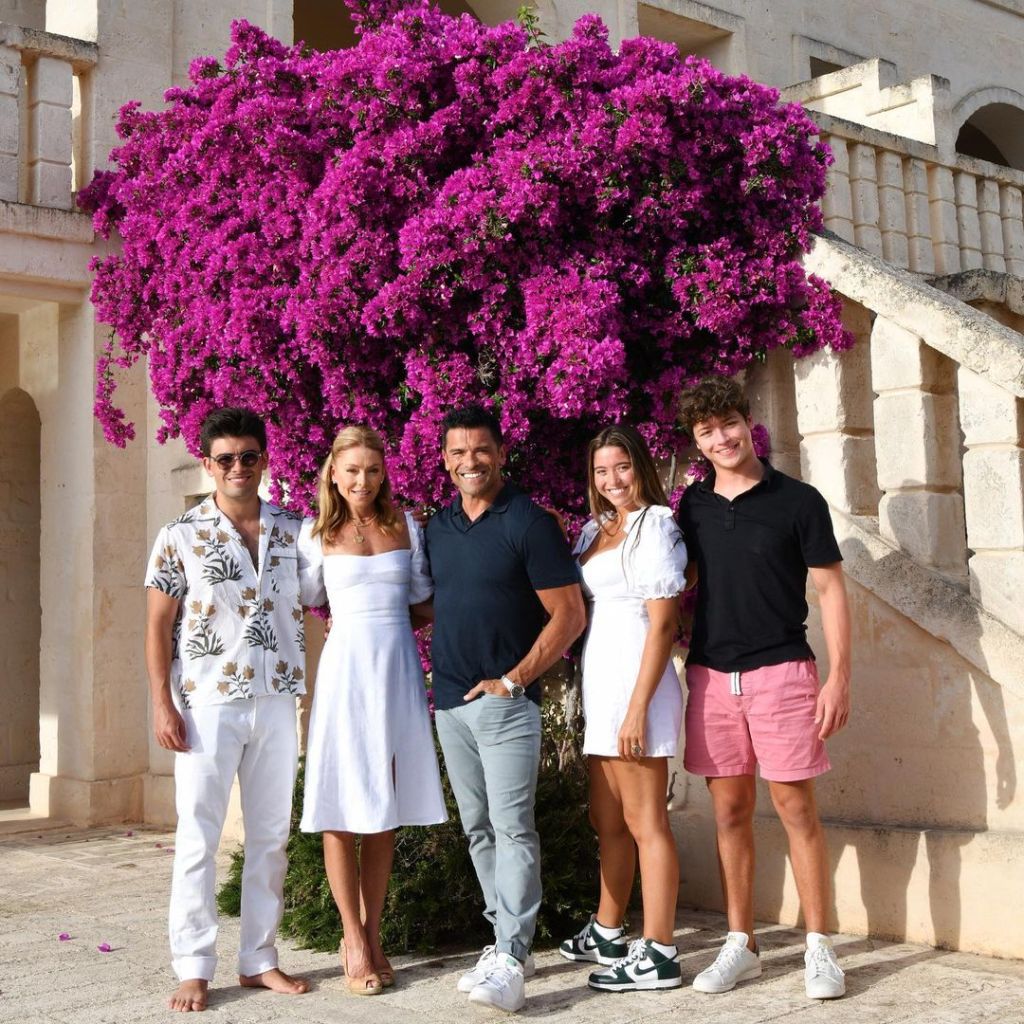 Kelly Ripa and Mark Consuelos pose with their two sons and one daughter.
