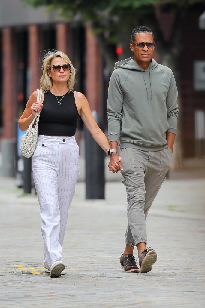 amy robach and tj holmes holding hands