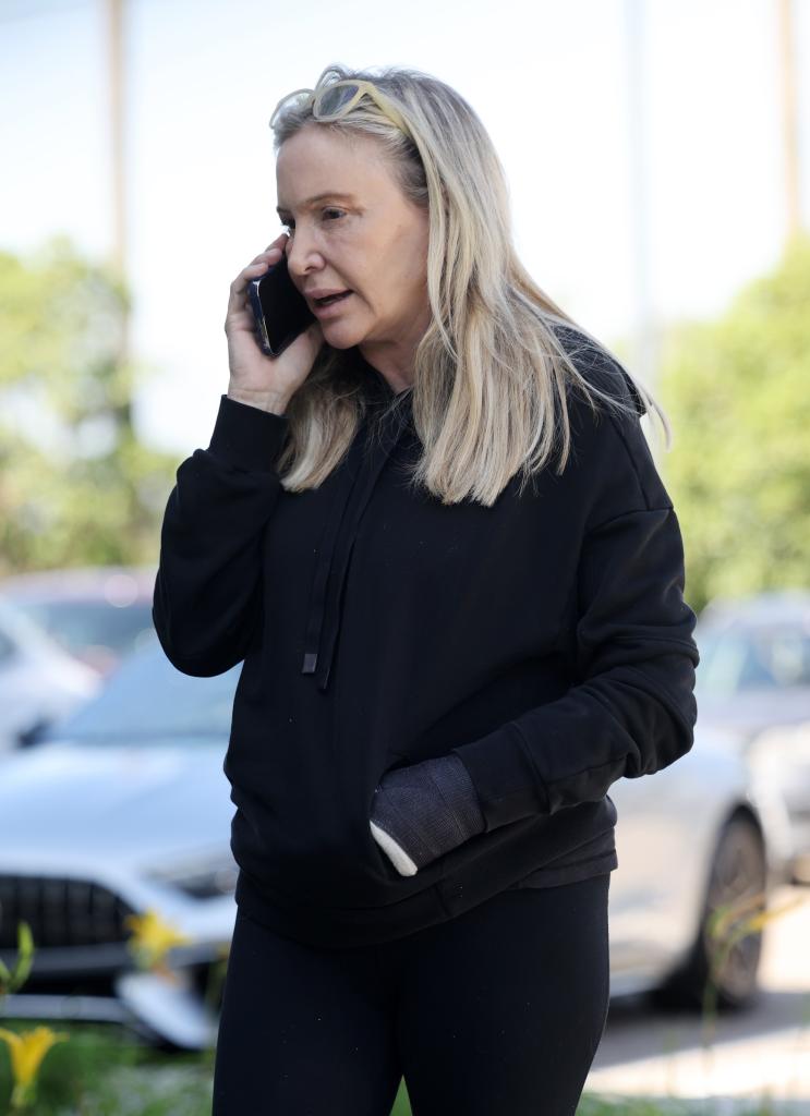Shannon Beador walking and talking on the phone