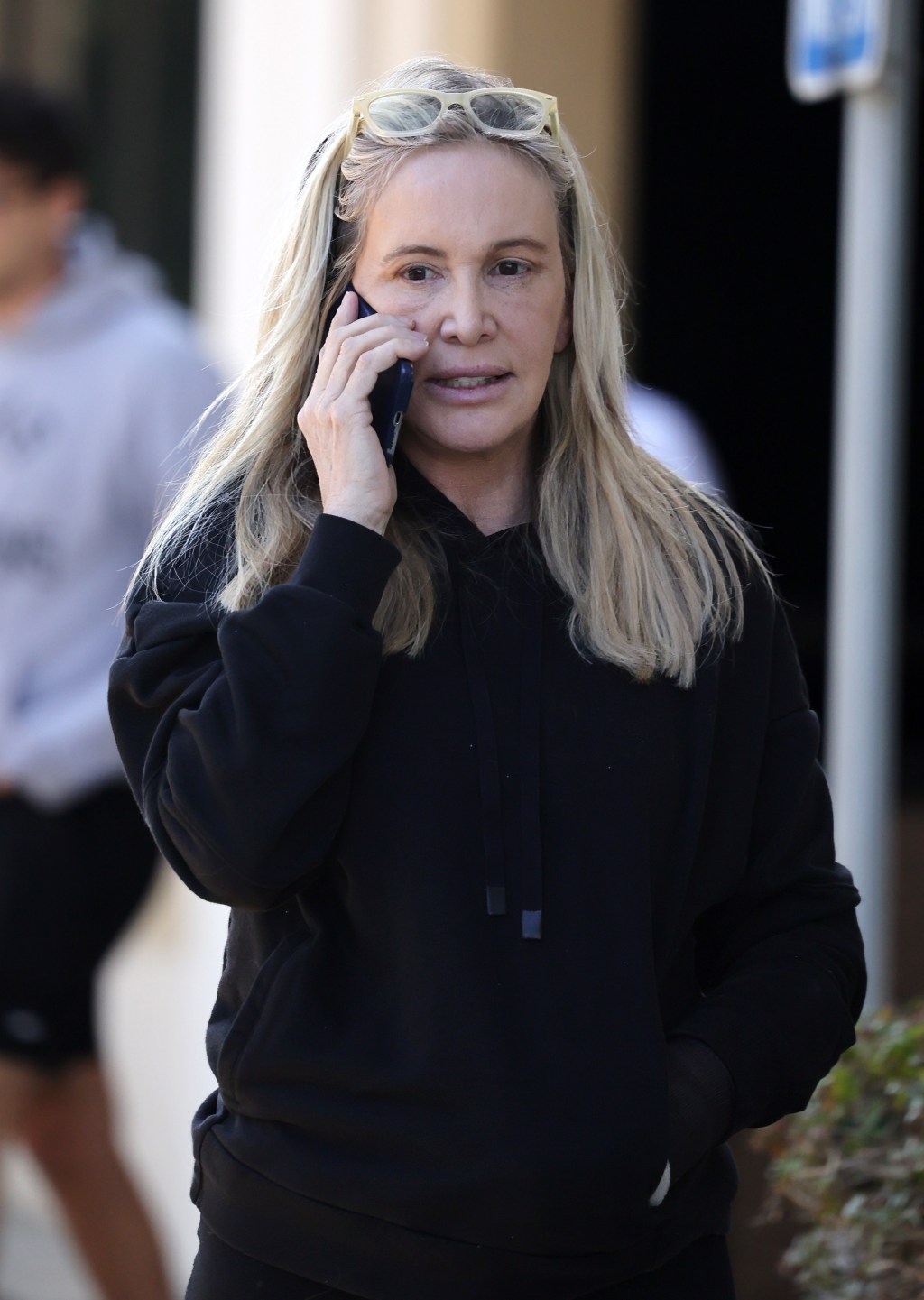 Shannon Beador walking and talking on the phone