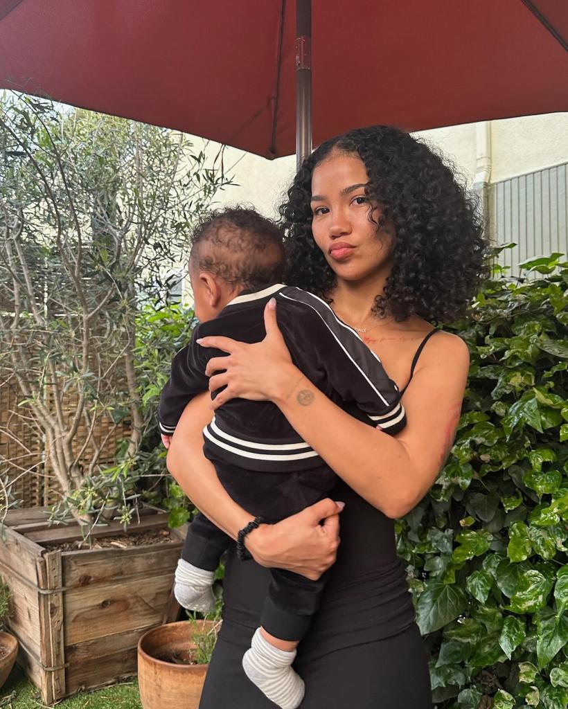 Jhené Aiko holding her son, Noah.