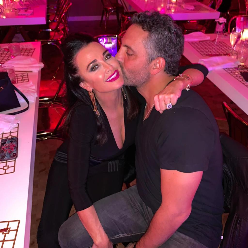 Mauricio Umansky kissing Kyle Richards