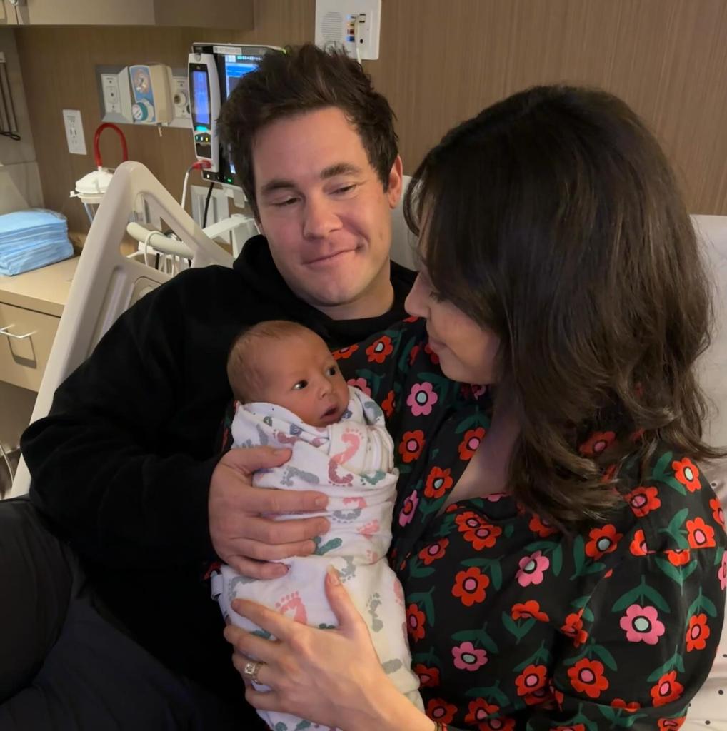 Adam Devine and Chloe Bridges with their newborn Beau