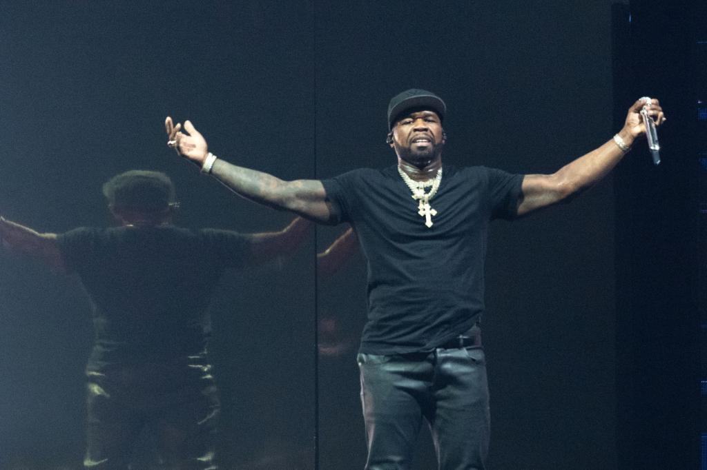 50 Cent performs on stage at The OVO Hydro.