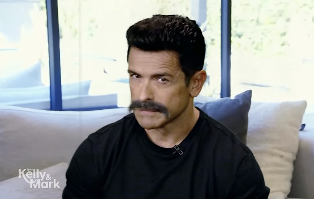 Mark Consuelos smirking