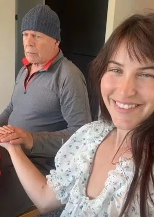 Bruce Willis and Scout Willis holding hands