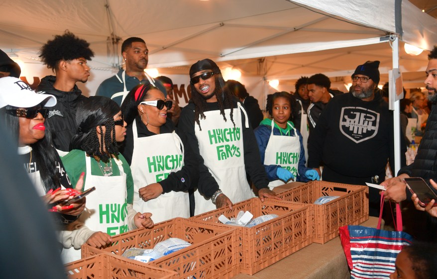 Quavo (C) attends "Huncho Farms" hosted by Quavo Cares & Urban Recipe in Atlanta Community ahead of Thanksgiving on November 20, 2023 in Atlanta, Georgia
