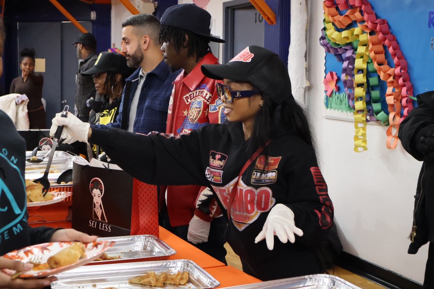 Lola Brooke and NYC restaurant Sei Less partnered to host and serve Thanksgiving meals at Children of Promise in Brooklyn.