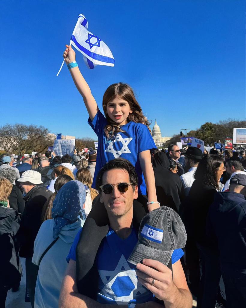 Ira Savetsky with his daughter at the Israel rally. 