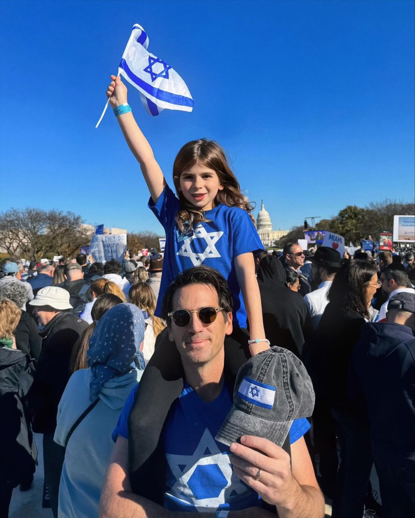 Ira Savetsky with his daughter at the Israel rally. 