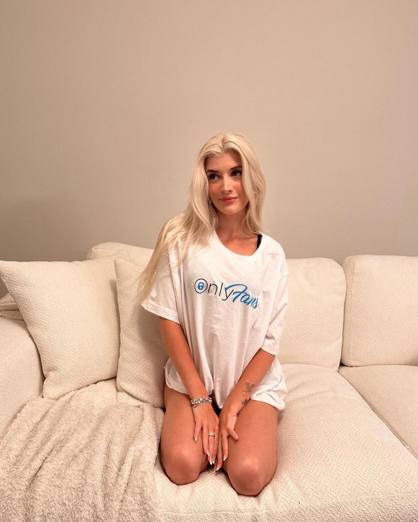 Sami Sheen in an OnlyFans T-shirt on the couch