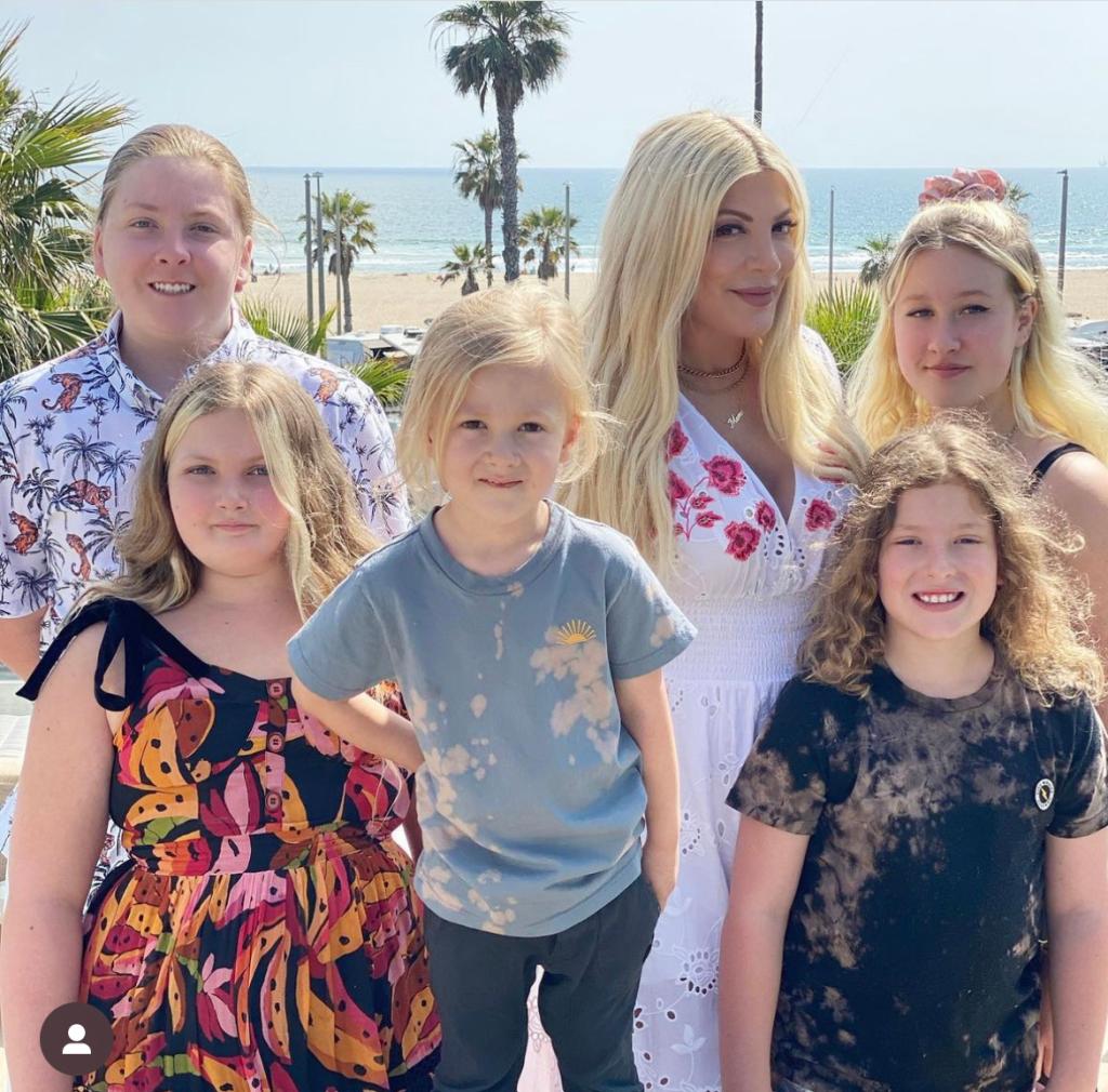 Tori Spelling posing with her kids.