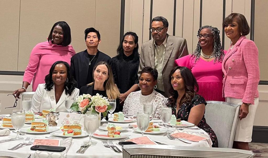 Angelina Jolie, Pax and Maddox posing at an AKA luncheon.