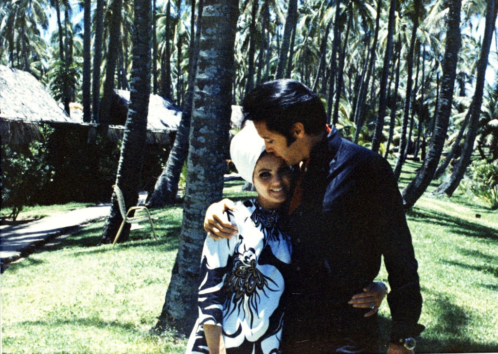 Elvis kissing Priscilla Presley's forehead