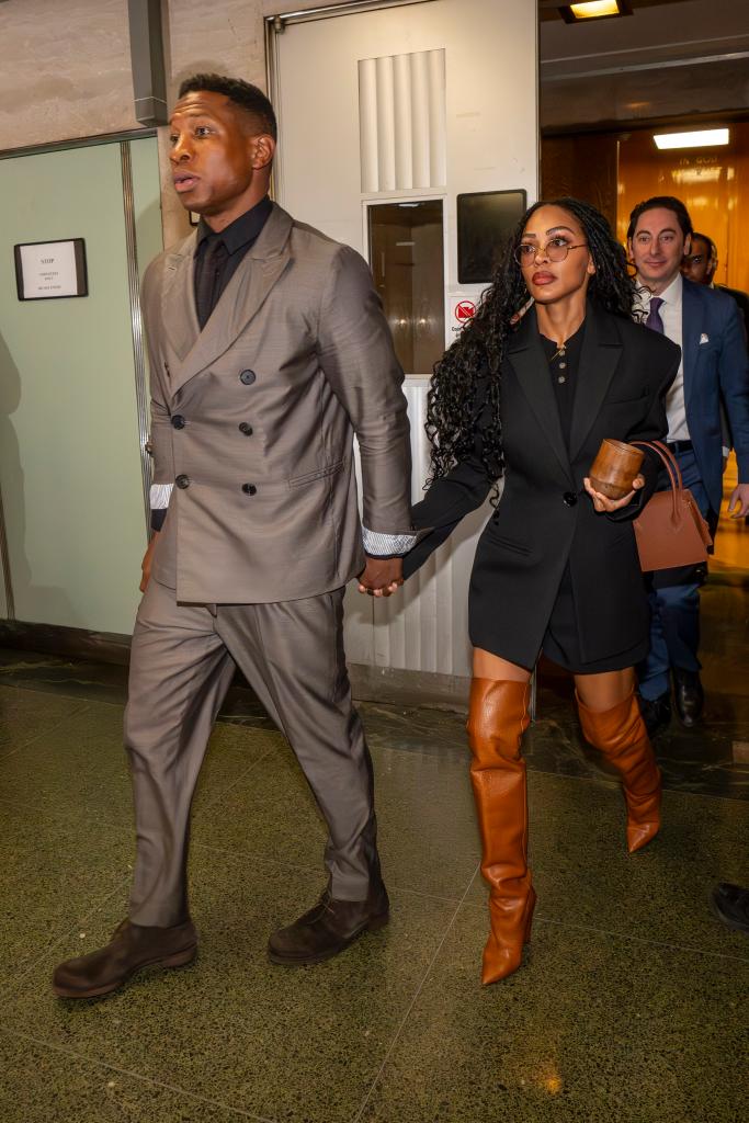 Jonathan Majors and Meagan Good holding hands