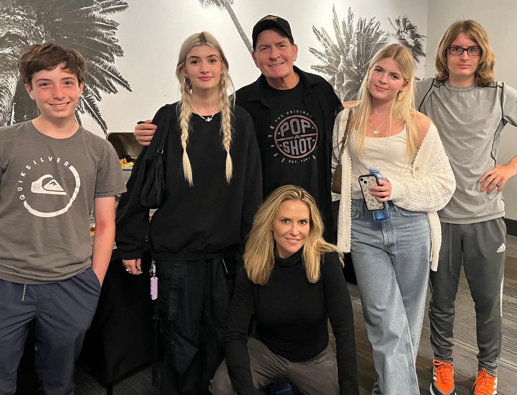 Charlie Sheen posing with his kids.