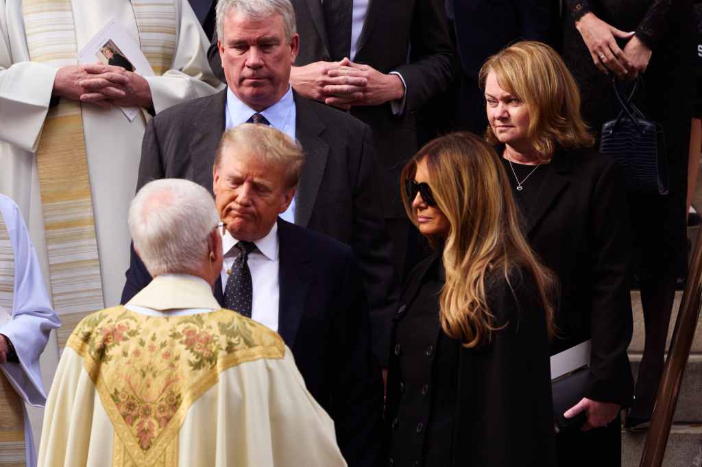 President Donald Trump, his wife Melania Trump talking to the priest at a funeral