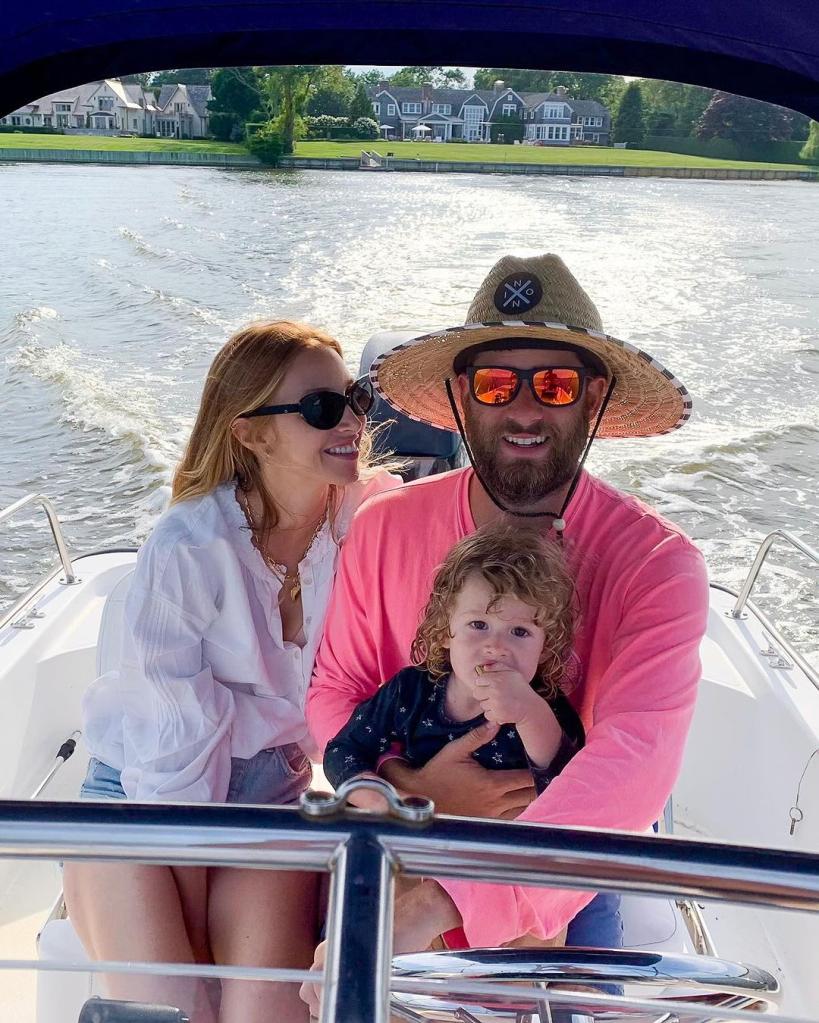 whitney port, tim rosenman and their son on a boat