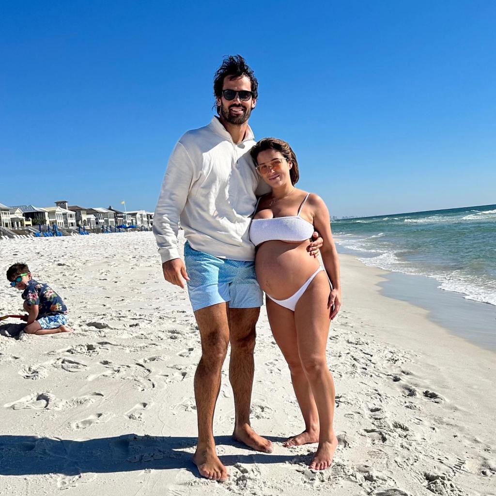Pregnant Jessie James Decker and Eric Decker on the beach