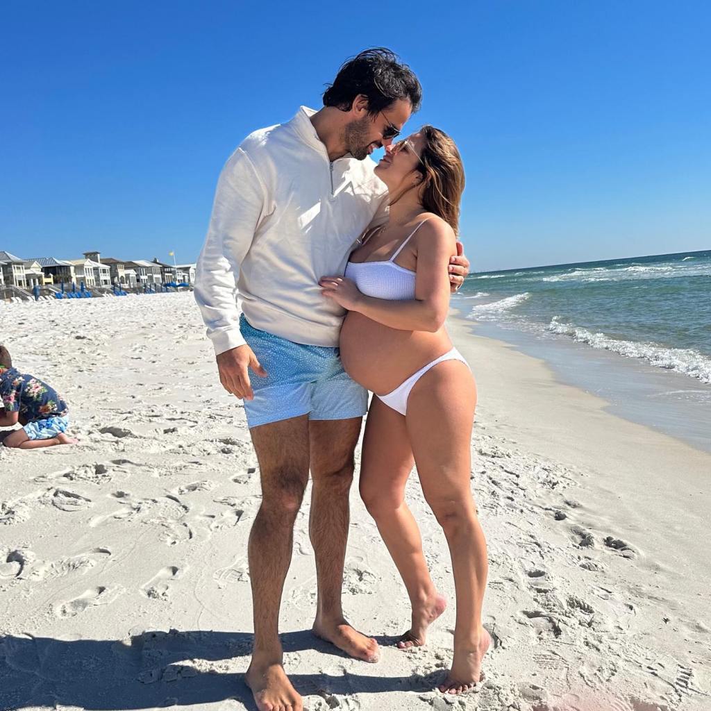 Pregnant Jessie James Decker and Eric Decker on the beach