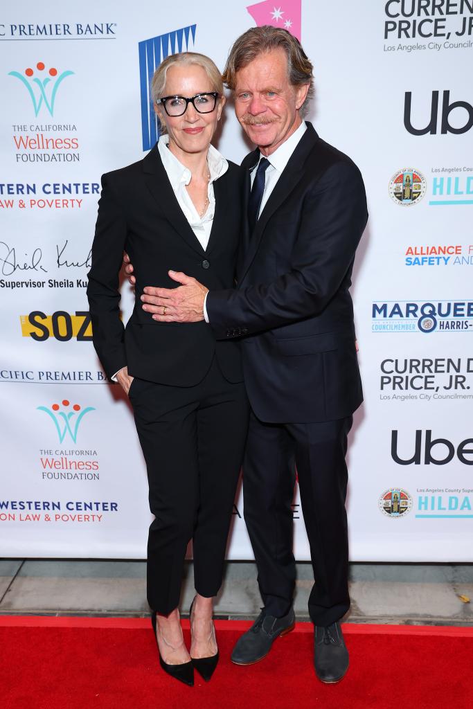 Felicity Huffman and William H. Macy pose on a red carpet together 