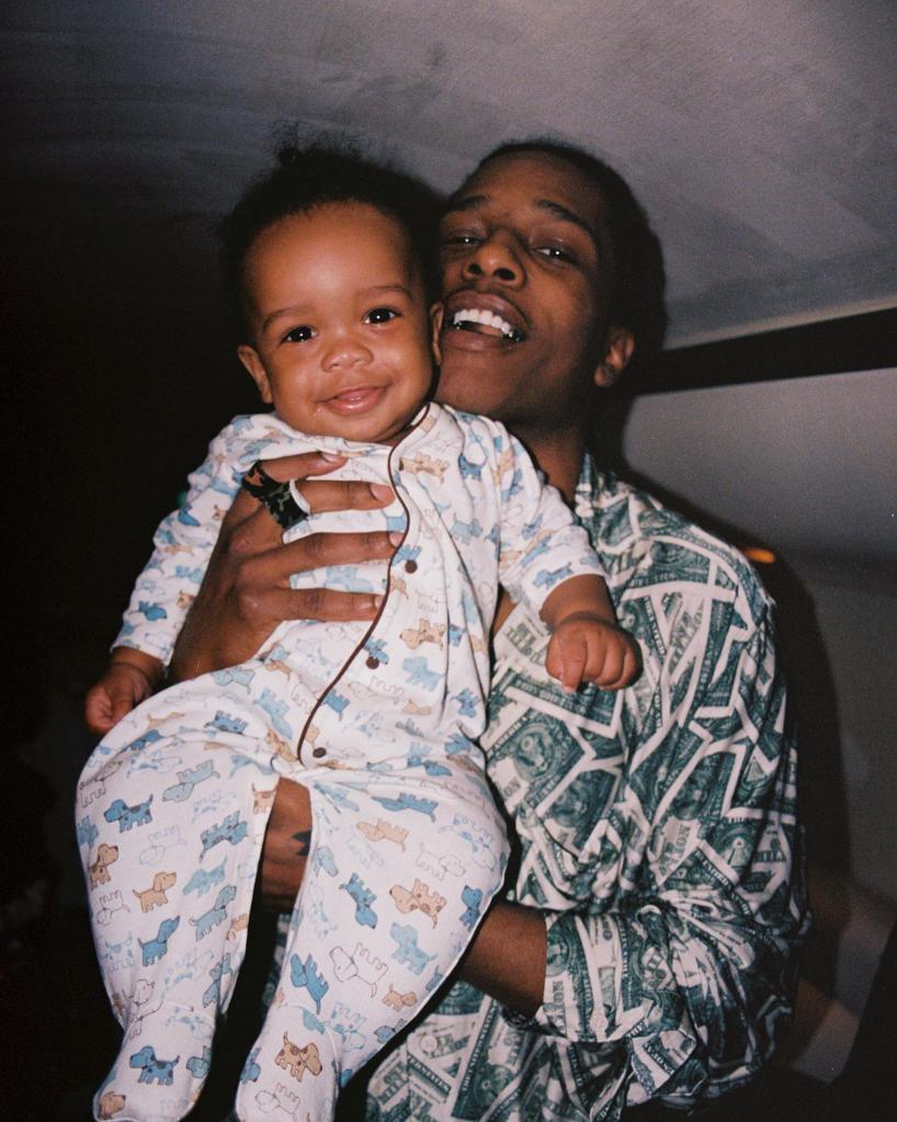 A$AP Rocky holding his oldest son, RZA.