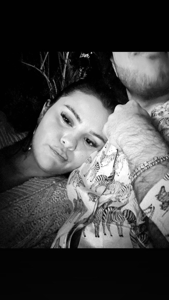 Selena Gomez selfie cuddled up on a male